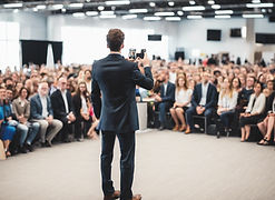 suited man back view while having speech