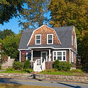 Traditional Home In Sudbury, Massachusetts With Front Porch And Autumn Trees