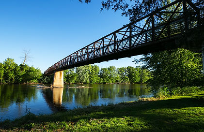 metal truss bridge over a river in ionia