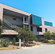 Modern multi-story building with a tiled geometric facade
