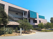 Modern multi-story building with a tiled geometric facade