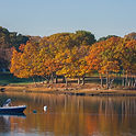 Lake View In Danvers, Massachusetts With Boat And Autumn Foliage Reflections