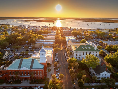 aerial view of fernandina beach at sunset with view of street and buildings