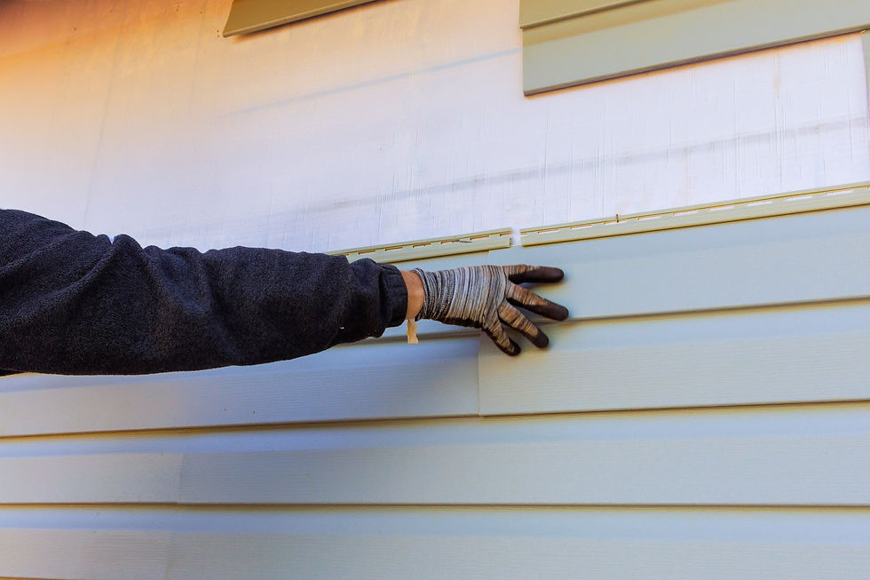 Damaged plastic siding is replaced as part of exterior house remodel.jpg