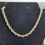 Thumbnail: Gold Colored Braided Necklace