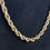 Thumbnail: Gold Colored Braided Necklace