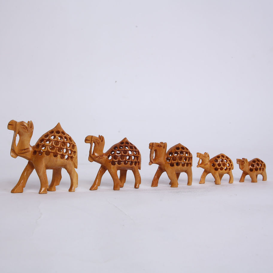 "Hand-carved wooden camel figurine, showcasing intricate craftsmanship."
