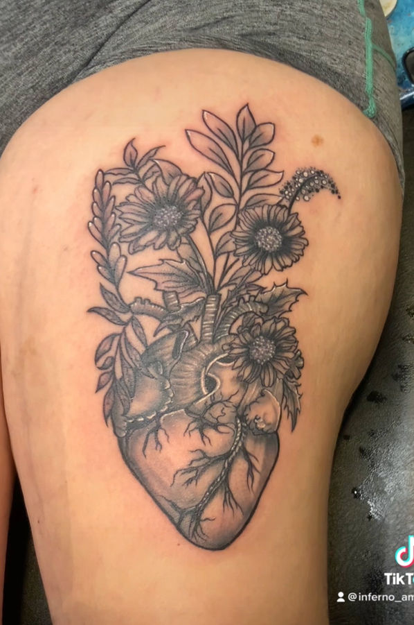 flowers and anatomical heart black and white tattoo