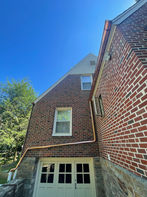 Various images showcasing high-quality roofing work by Melcher Construction, including detailed shots of shingle installation, copper work, gutter placement, and roof repairs on a brick house. The images highlight the craftsmanship and attention to detail in different aspects of roofing services, such as custom copper flashings, slate roofs, and overall roof structure.