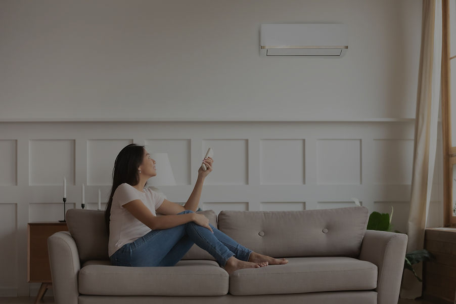 Person Using AC Remote Control_edited.jpg
