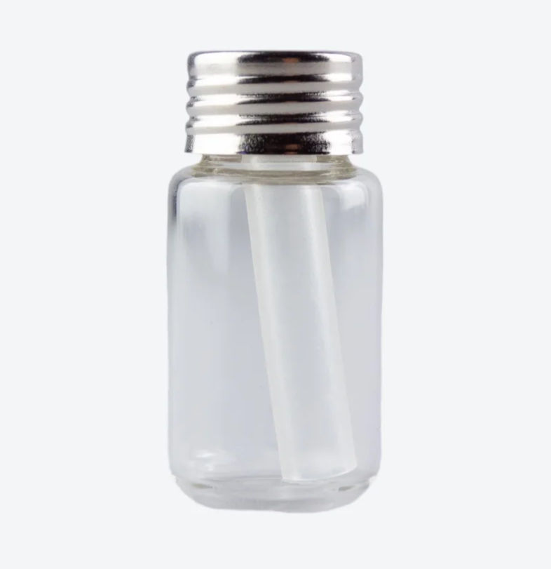 Getxent training aid tube in glass container