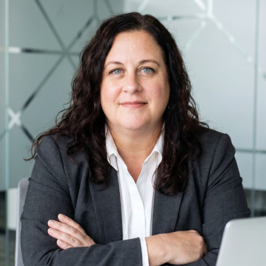 April Hardy, founder of In Case I'm Murdered, LLC, smiling in a professional headshot