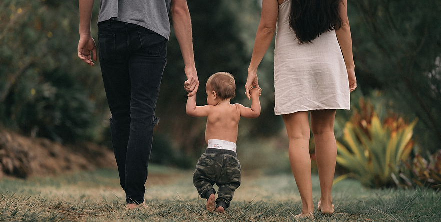 family-holding-hands-baby copy.png