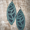 Thumbnail: Two layered sculpted oval leather earrings. Topaz and pine green color combo