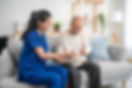 Care team assisting elderly person with daily living tasks