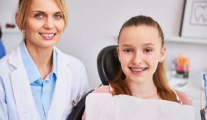 smiling-female-orthodontist-child-dentist-s-office_329181-17720.jpg