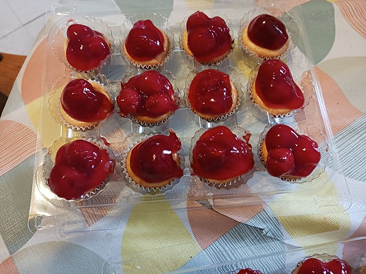 Mini Cheesecakes topped with Strawberries and Cherries_edited.jpg
