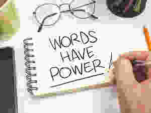 Words have power handwritten on spiral bound notebook