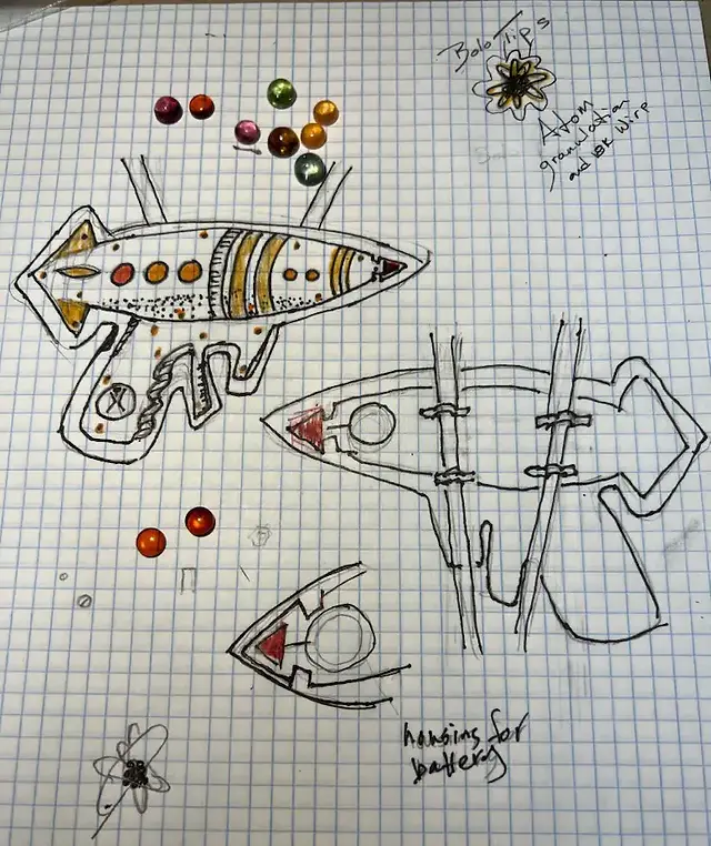Sketches on graph paper for ray gun bolo tie pendant
