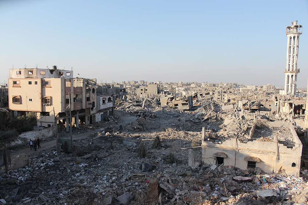 Widespread destruction is evident in Gaza, with remnants of buildings amid the rubble.
