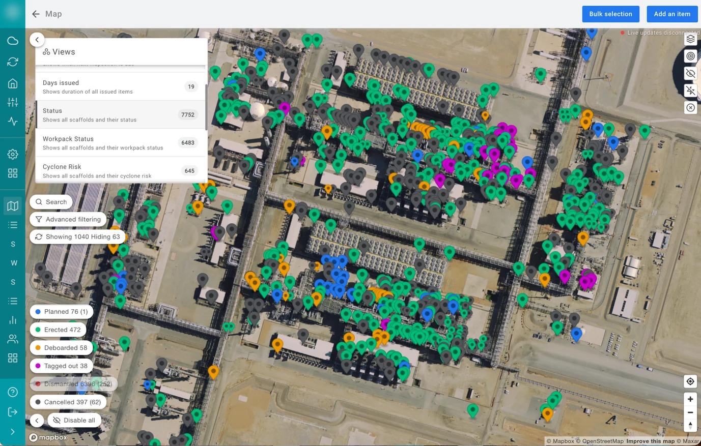 EXTAG live map of a large industrial site with hundreds of colour-coded scaffold pins, a Views panel for status, workpack status and cyclone risk, and a status legend with counts.