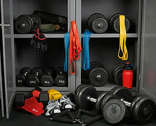 gym-storage-cabinet-with-various-fitness-equipment-including-dumbbells-resistance-bands-wa