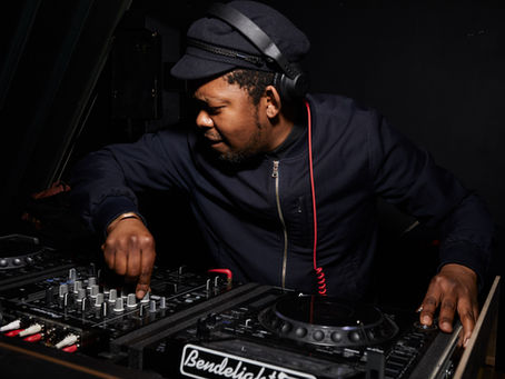 Mo Laudi mixing a live DJ set at the decks