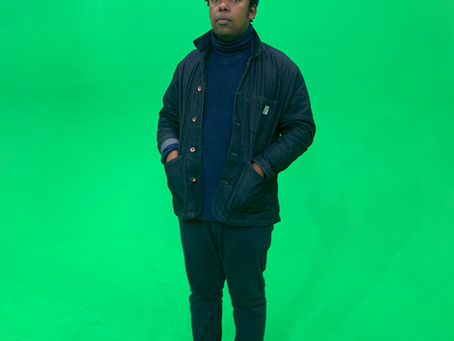 Mo Laudi, South African Afro house DJ and producer, against a green background