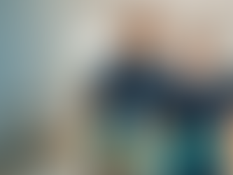 photo of Professional house cleaners from U B Lazy Cleaning Service in a tidy San Antonio living room, carrying supplies for residential cleaning.