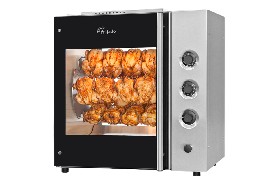 Rotisserie oven with cooked chickens inside,