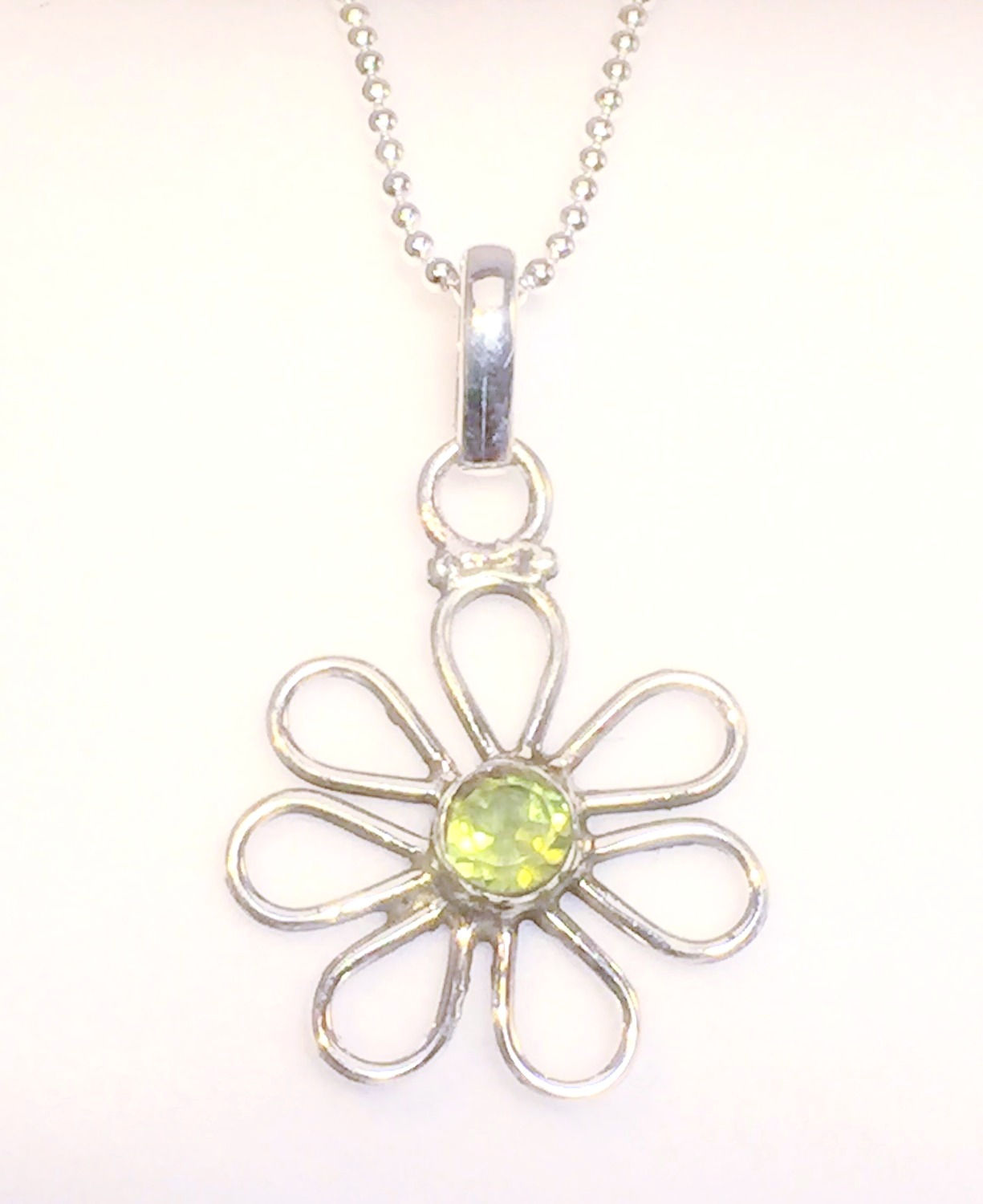 Peridot Cutstone daisy pendant in sterling silver. August Birthstone