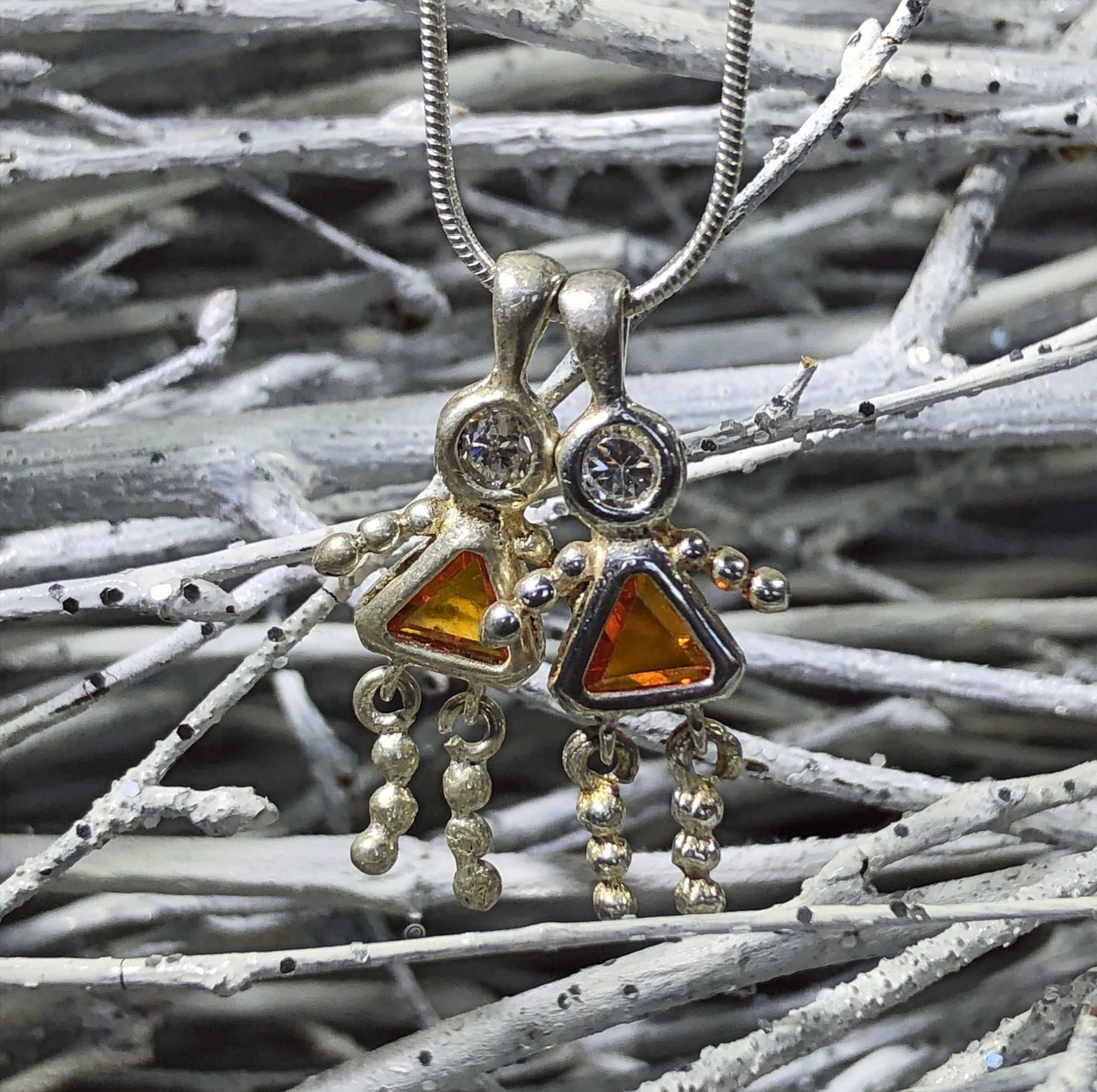 Sterling silver cut stone and CZ girl pendant with animated limbs