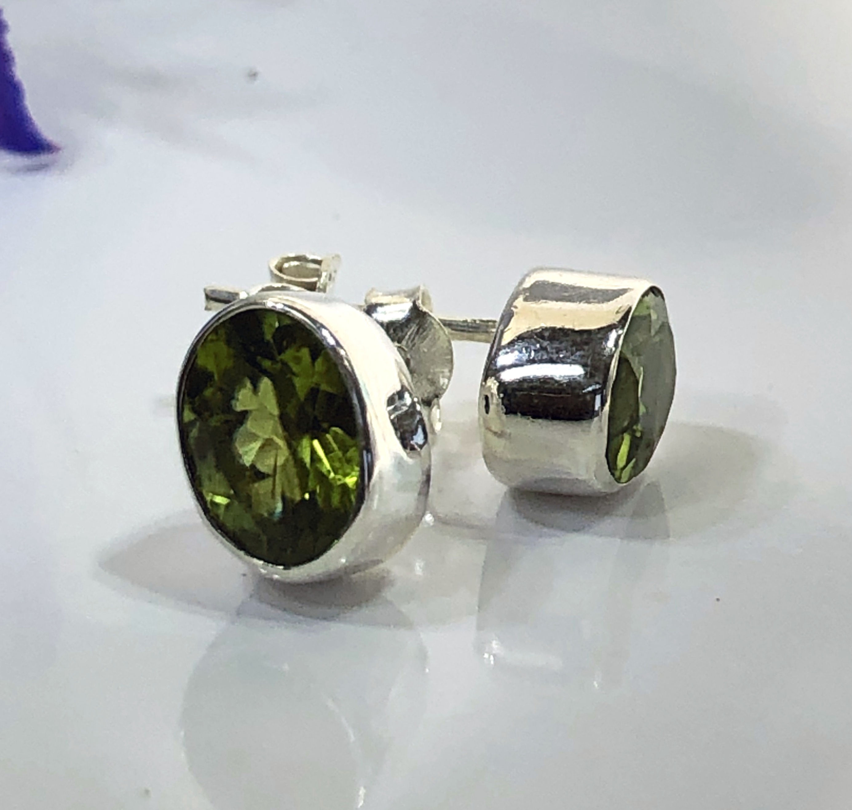 Oval peridot, olivine cut stone stud earrings in sterling silver