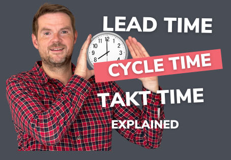 Russell Watkins Sempai holding a clock face to talk about time in lean manufacturing