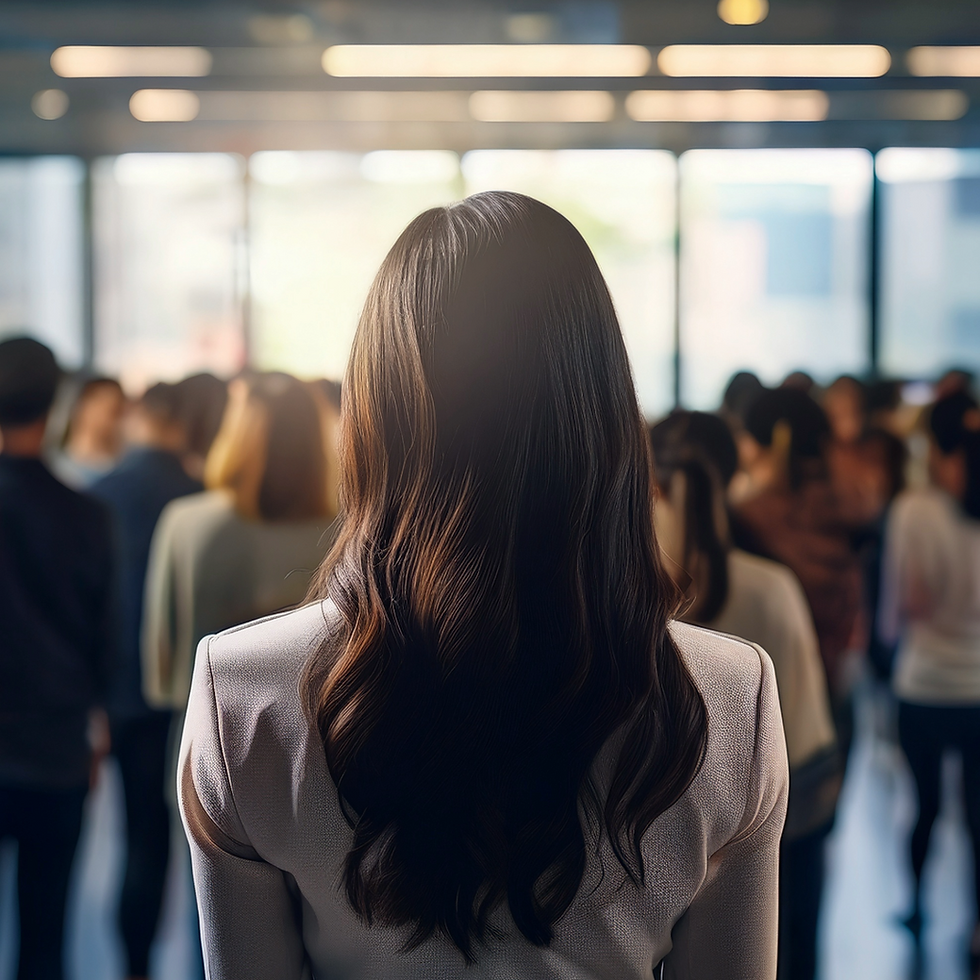 The back of a woman, who is standing at the edge of a crowd of people, a blog cover for a story on neurodivergent belonging