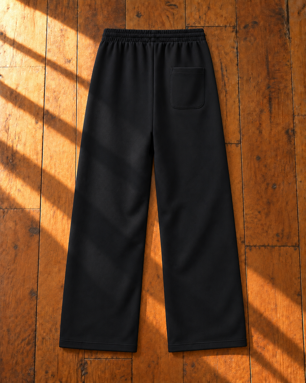 Black Daily Curved Stripe Sweatpants back flatlay on sunlit hardwood floor
