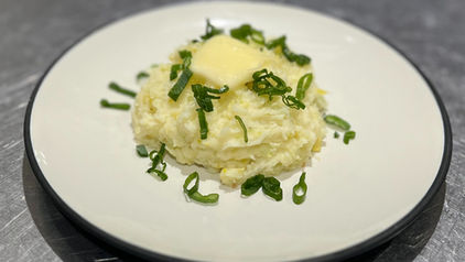 Colcannon potatoes with melting butter and green onions
