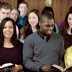 Choir singers with open sheet music