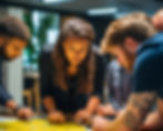 Team of professionals collaborating over a large map, showcasing Avant Global's AI strategy and consultation services for organizational planning and implementation