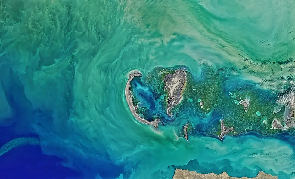 Satellite image showing a swirling turquoise and blue ocean pattern, highlighting geospatial imaging technology
