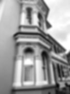 Auckland’s Allendale House Italianate heritage villa with double‑bay windows, decorative verandah and octagonal turret restored by Wilkran.