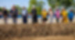 Group of people breaking ground, smiling, holding shovels. First Steps Centers