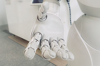 White robot extending an open hand