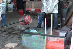 Pouring Melted Aluminum over Orbez