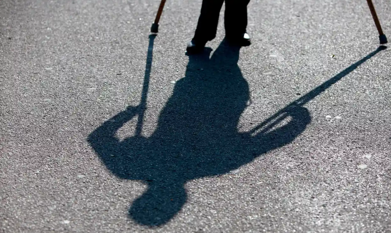 shadow of person with crutches