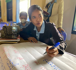 Teacher trainee thinking, reviewing information and writing.jpg