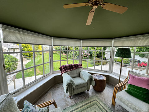 Roller blinds in a brick built conservatory
