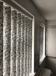 New vertical blinds in a bathroom
