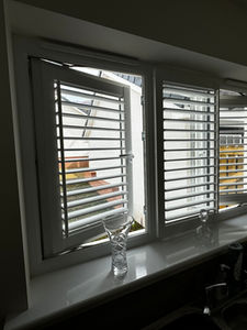 Perfect fit shutters in open kitchen window