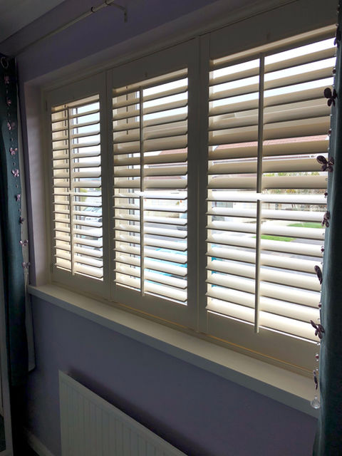 shutters on a long window